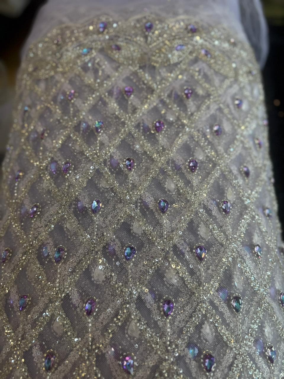 Premium glitter embroidered fabric.